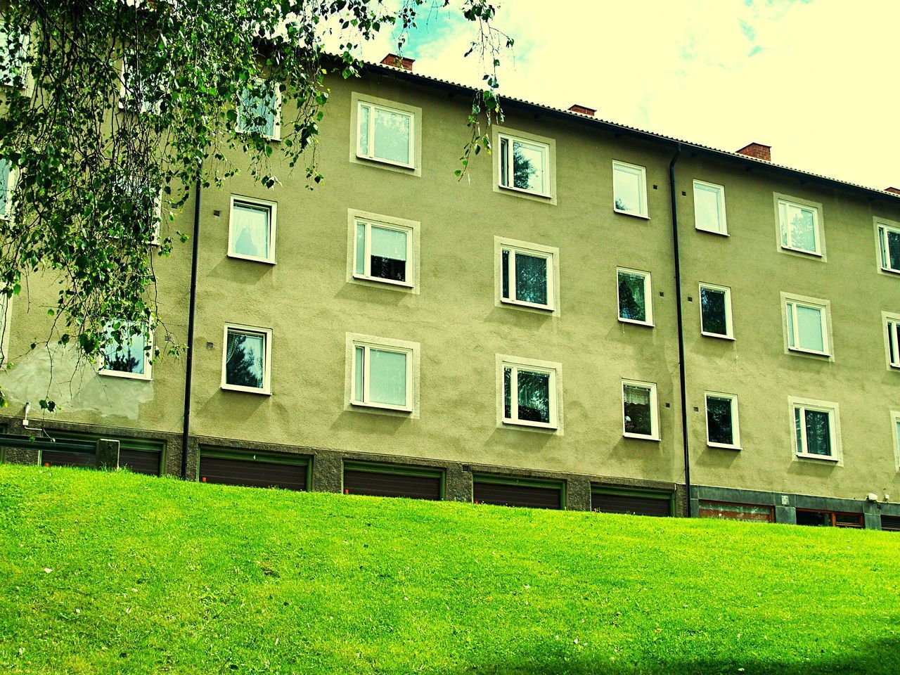 LOW ANGLE VIEW OF RESIDENTIAL BUILDING