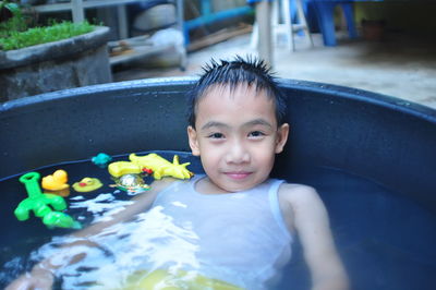 Portrait of boy in wading pool