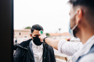 Portrait of man holding camera