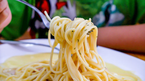 Close-up of yellow served in plate on table