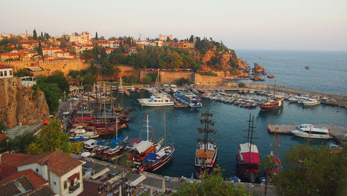 View of harbor and town against sky