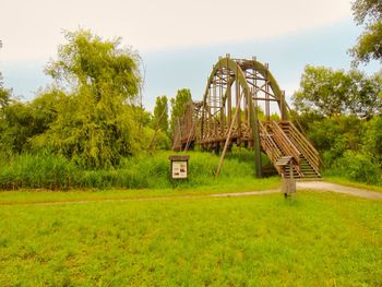 Abandoned built structure on field against sky