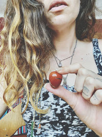 Midsection of woman holding ice cream