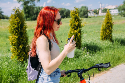 Young woman with bicycle