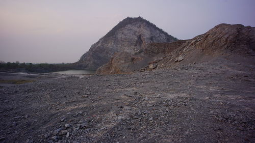 Rock formation on land against sky