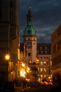 Illuminated street in front of old town hall in leizpig, germany