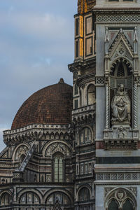 Low angle view of ornate building against sky