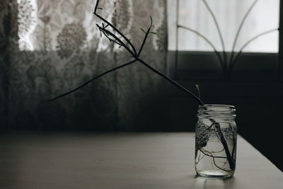 Close-up of glass jar on table