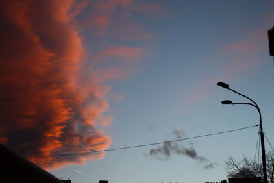 Low angle view of silhouette street light against sky during sunset