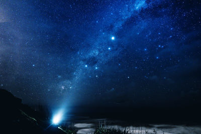 Scenic view of star field against sky at night