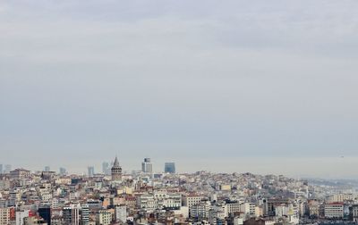 High angle view of buildings in city against sky