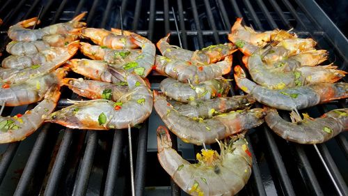 Close-up of prawns on barbecue grill