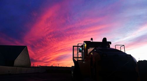 Silhouette building against sky during sunset