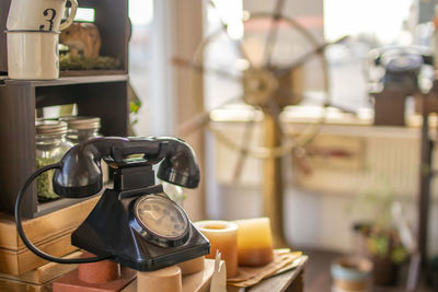 Close-up of telephone booth on table at home