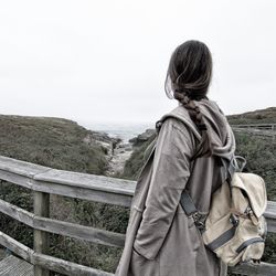 Rear view of man against sky