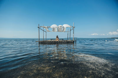 Scenic view of sea against blue sky