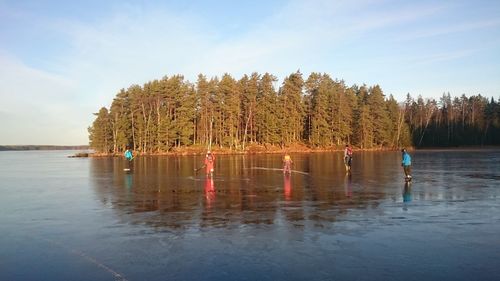 Scenic view of calm lake against blue sky