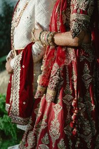 Midsection of woman wearing traditional dress