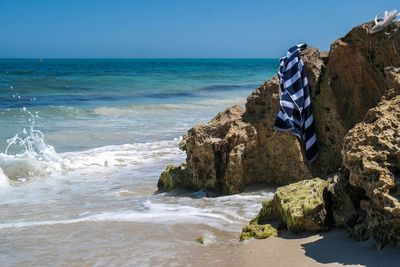 Scenic view of beach against clear sky