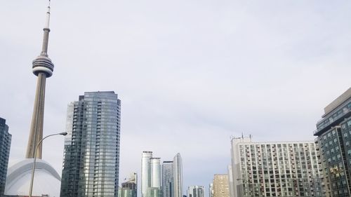 Low angle view of buildings in city against sky