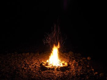 Bonfire on field at night