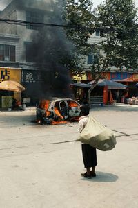 Woman standing on city street