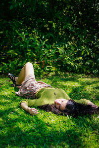 Teenage girl lying at park