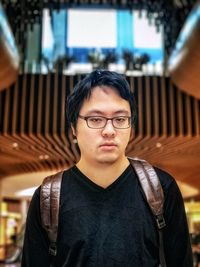 Portrait of young man wearing eyeglasses