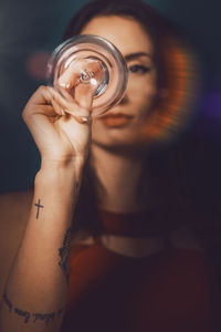 Midsection of a woman drinking glass