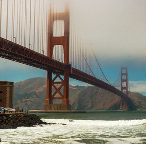 Suspension bridge over river in city