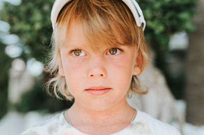 Portrait face of candid happy little kid boy of five years old with problem allergic skin