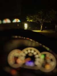 View of illuminated street lights at night