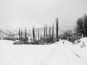 Scenic view of snow covered landscape against clear sky