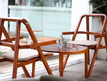 Empty chairs and table in restaurant