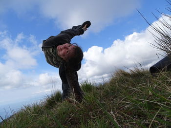 Full length of man on field against sky