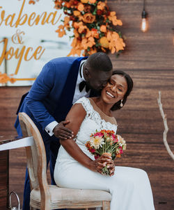 Young couple holding bouquet