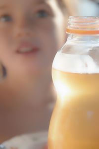 Portrait of girl having drink in bottle