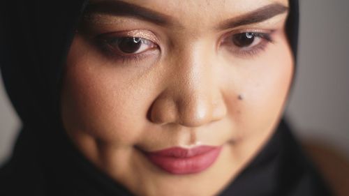 Close-up portrait of young woman