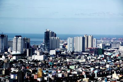 View of cityscape with sea in background