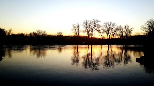 Scenic view of lake at sunset