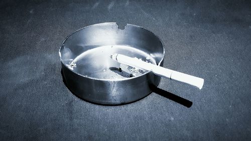 Close-up of cigarette in ashtray