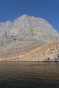 Scenic view of mountain against blue sky