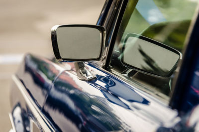 Close-up of vintage car on side-view mirror