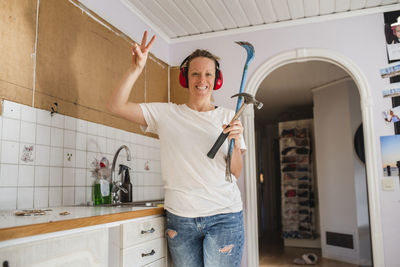 Woman renovating kitchen