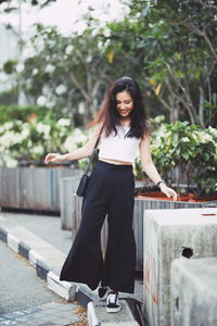 Portrait of smiling young woman outdoors