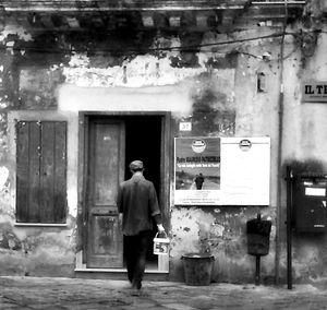 Full length of woman standing by railing