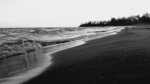 Scenic view of beach against clear sky