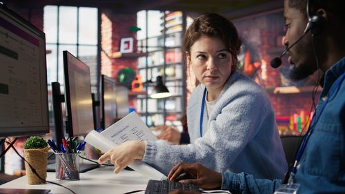 Portrait of young woman using digital tablet in cafe