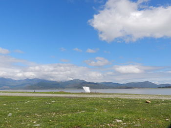 Scenic view of landscape against cloudy sky