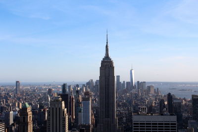 Modern buildings in city against sky